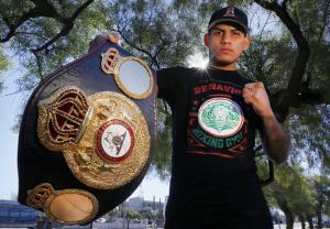 Jose Benavidez holding championship belt